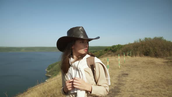 Beautiful Female Walking with Backpack Near Bakota Bay