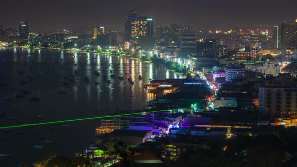 day to night timelapse of Pattaya city and the many boats docking