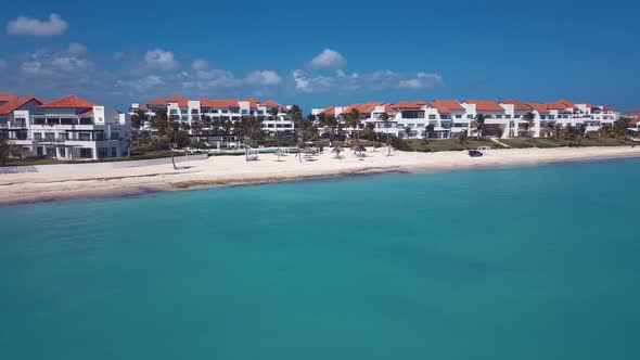 Caribbean Beach With Hotel In The Paradise With Palms Tree 4k 24fps