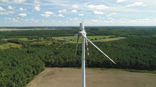 Wind Turbines With Damaged Blades Against Lush Vegetation In Wiatrak, Poland. Aerial Drone Shot