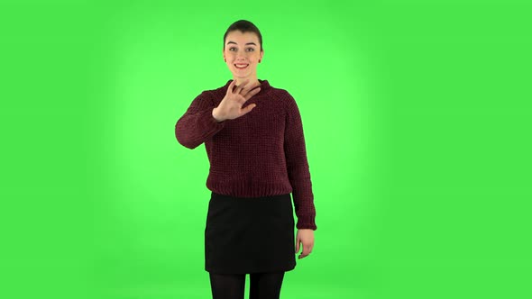 Happy Woman Waving Hand and Showing Gesture Come Here. Green Screen