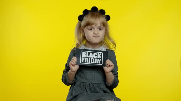 Cheerful Stylish Child Girl Smiling, Holding Black Friday Text Inscription, Rejoicing Good Discounts