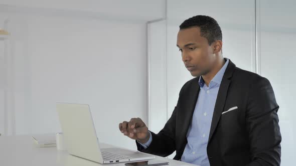 Casual AfroAmerican Businessman Leaving Office After Work