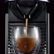 Front view of coffee machine pouring fresh drink into glass cup - VideoHive Item for Sale