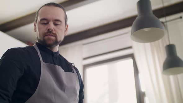 Portrait of a Young Handsome Man Chef at Work