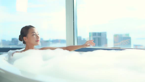 Young asian woman relax in bathtub