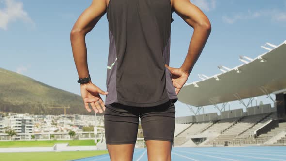 Caucasian athlete preparing for race in stadium