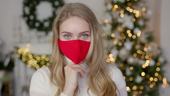 Portrait of a Beautiful Woman. Woman Wears the Protective Mask From the Virus. Pandemic Christmas