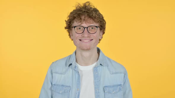 Smiling Redhead Young Man Yellow Background