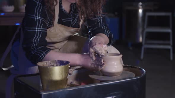 Pottery Crafting in the Art Studio  Woman Forming a Simple Pot Out of Clay