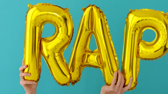 Golden RAP Words Made of Inflatable Balloons