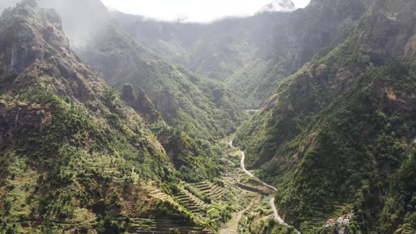 Aerial is flying backwards showing beautiful landscape on Serra de Agua,  Madeira, Portugal.