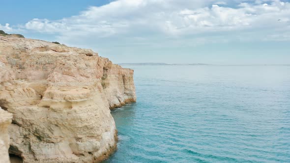 Drone Footage of the Rocky Cliffs Forming Sharp Coastline