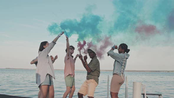 Friends with Smoke Bombs on Pier