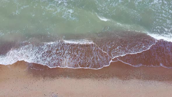 Aerial Dron Shot of the Baltic Sea Costline With Waves View From Above. Sea Waves Over a Sandy Beach