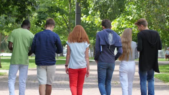 Group Stylish Student with Notebook on Footpath Outdoor