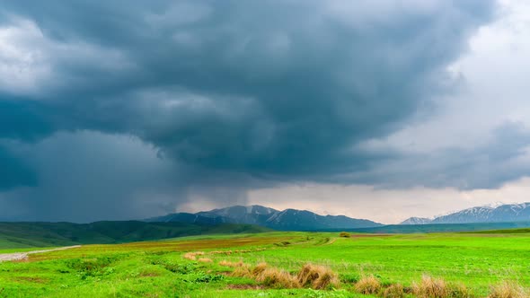 Epic tornado formation over hilly terrain alt