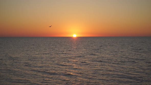 Beautiful Sunset on the Sea. Orange Sunset. Sunset with Sea View. Yellow-red Sun Going Into the Sea