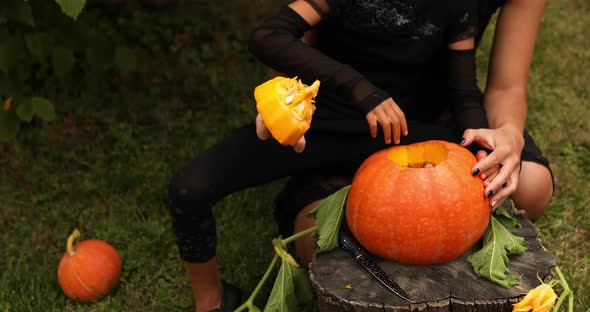 Daughter and Mother Hands Open Lid Pumpkin, Before Carving for Halloween