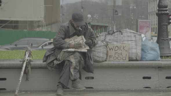 The Inscription "Need Food" By a Poor Homeless Tramp. Kyiv. Ukraine