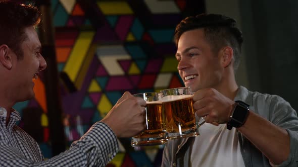 Friends toasting glass of beers