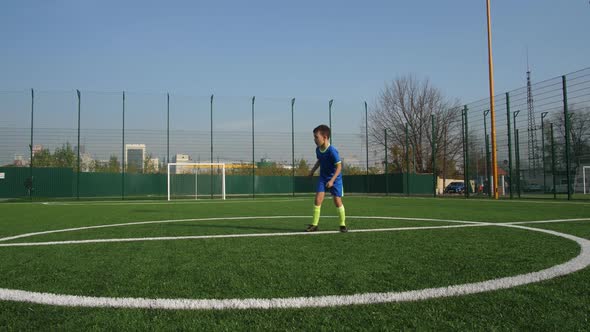 Young Footballer Taking Pass and Running To Goal