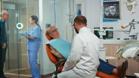 Orthodontist Speaking to Patient with Toothache