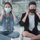 young asian travel couple friend wear facial mask protection look at camera sit relax smile - VideoHive Item for Sale