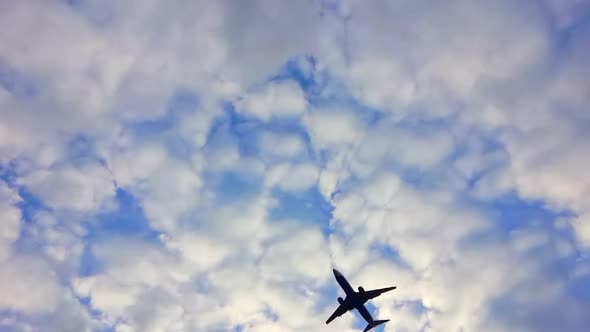 Airplane Flight in the Sky in Cloudy Cloudy Summer Weather