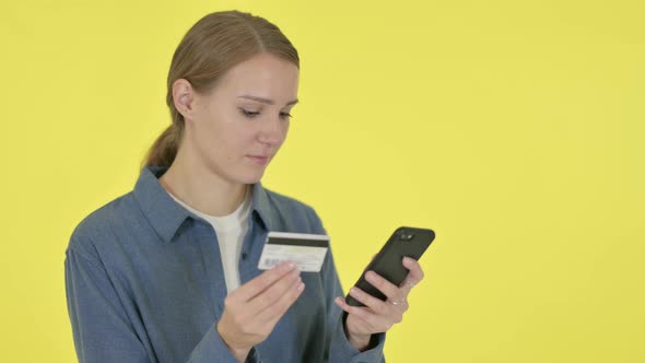 Online Shopping Failure on Smartphone By Woman on Yellow Background