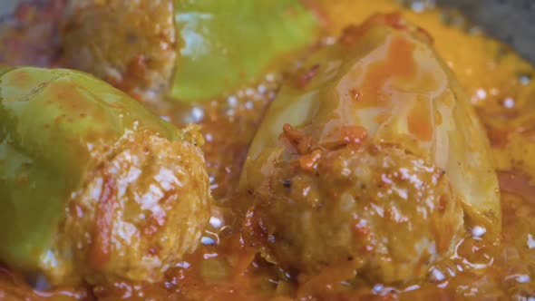 Preparation of Stuffed Peppers in Tomato Sauce