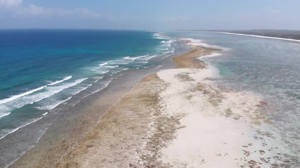 Ocean Coastline and Barrier Reef at Low Tide Zanzibar Matemwe Aerial View