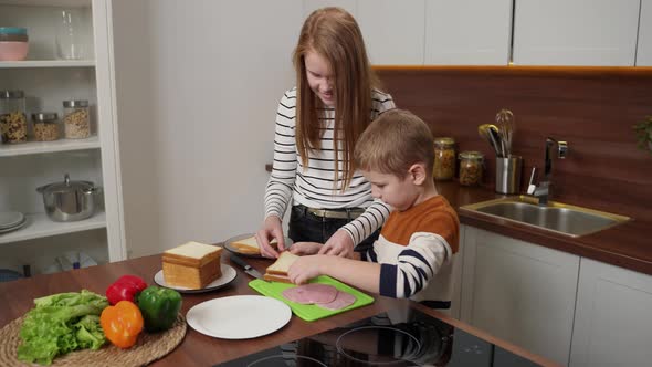 Adorable Deaf Kids Making Sandwiches in Kitchen