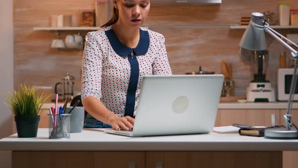 Business Woman Working From Home Using Laptop