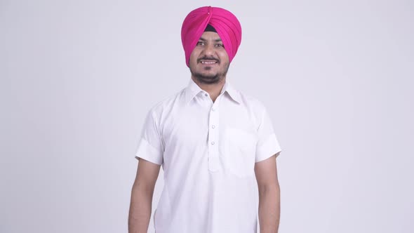 Happy Bearded Indian Sikh Man Smiling and Wearing Turban