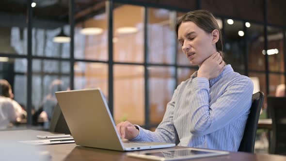 Woman with Neck Pain Working on Laptop