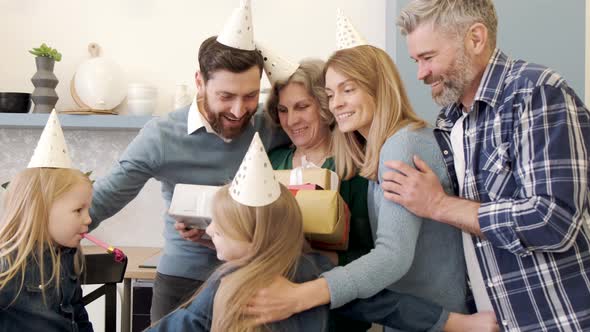 Family Congaratulate Grandmother with Happy Birthday