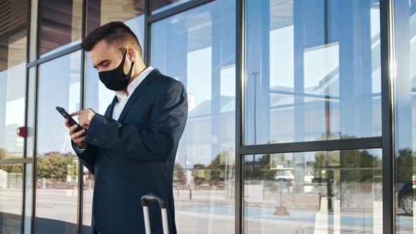 Elegant businessman in airport. Young mail entrepreneur in formalwear.