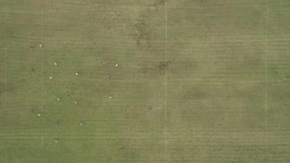 Aerial Top Down View of Soccer Field and Two Professional Teams Playing Soccer