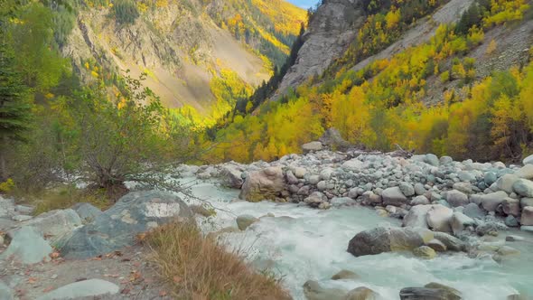 Mountain river in the autumn mountains. A turbulent current. Georgia, Svaneti.