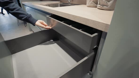 A kitchen showroom gimbal shots of drawers being opened