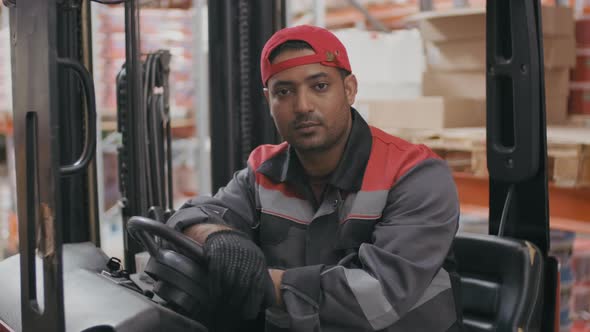Portrait Of Worker In Forklift Machine