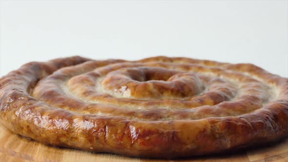 Hot Homemade Sausage Lies on the Cutting Board