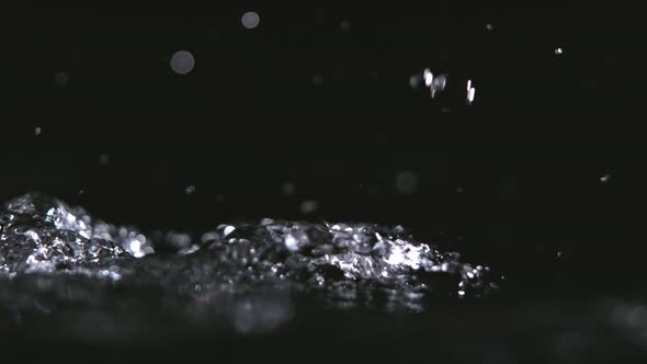 Super Slowmotion Shot of Pouring Water Against Black Background at 1000 Fps