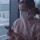 Woman in Protective Mask Uses Phone Waiting for Flight - VideoHive Item for Sale
