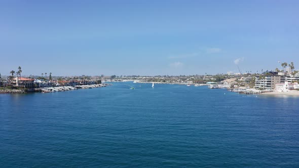 drone flight over bay channel to Newport harbor and Balboa island, in Orange county, CA, USA