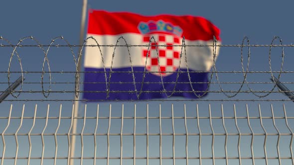 Flag of Croatia Behind Barbed Wire Fence