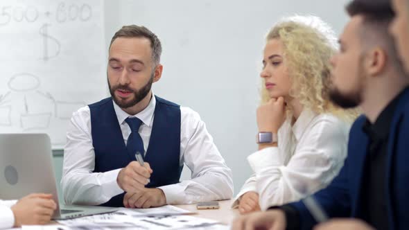 Businessman Male Teamleader Wearing Tie Talking and Discussing Working with Colleagues Team Meeting