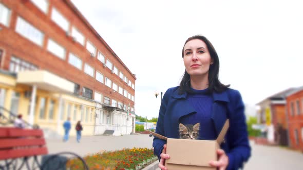 Gimbal Shot Girl Carries a Box of Abandoned Kittens to an Animal Shelter