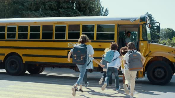 Group Students Running Boarding Schoolbus